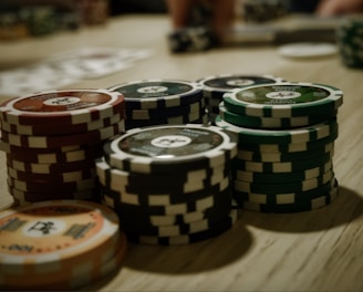 A vibrant screenshot of a rummy game table with colorful cards and chips.